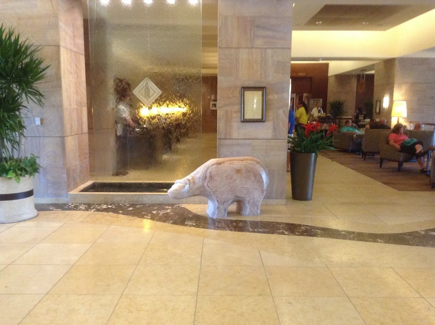 A polar bear statue in the lobby of an hotel.