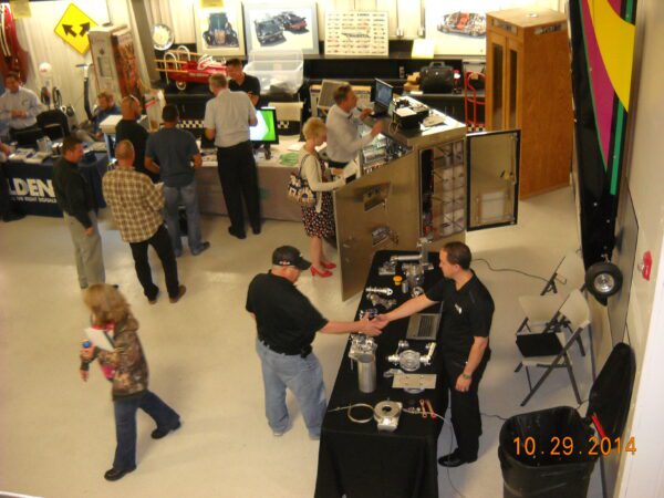 Group of people in a shop with tools.