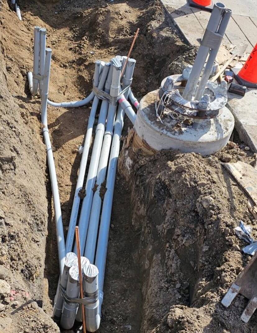 Utility cables in an excavation trench.
